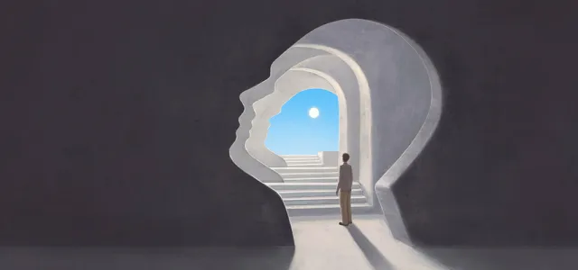 A person stands in a tunnel shaped like a human head, looking toward a bright sky and sun at the end of a staircase, symbolizing self-discovery or inner journey.